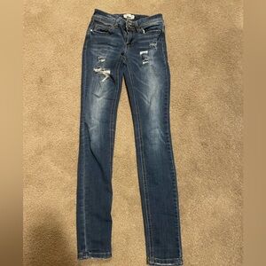 Ripped low rise skinny jeans